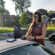 Brianna Wu (right) consults the canvassing app on her phone to see which houses we’ve hit while Frank Wu (left) puts signs and literature back in the car.